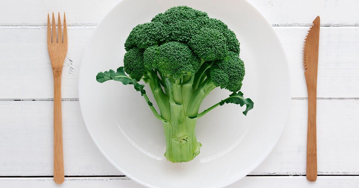 Head of Broccoli on a white plate